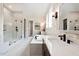 Spa-like bathroom with a soaking tub, glass shower, and marble flooring at 4213 Burlington Mills Rd, Wake Forest, NC 27587