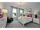 Bedroom with a white bed frame and colorful bedding at 4213 Burlington Mills Rd, Wake Forest, NC 27587