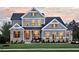 Stunning two-story home with stone accents and a manicured lawn at 4213 Burlington Mills Rd, Wake Forest, NC 27587