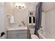 Small bathroom with a single vanity, toilet, and bathtub at 4213 Burlington Mills Rd, Wake Forest, NC 27587