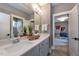 Double vanity bathroom with gray walls and white cabinets at 4213 Burlington Mills Rd, Wake Forest, NC 27587