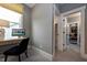 Home office with built-in desk and view into the bedroom at 4213 Burlington Mills Rd, Wake Forest, NC 27587