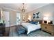 Spacious main bedroom with a king-size bed and ensuite bathroom at 4213 Burlington Mills Rd, Wake Forest, NC 27587