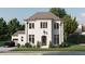 Stunning two-story home with a white brick facade and landscaped yard at 2617 St Marys St, Raleigh, NC 27609
