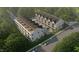 Aerial view of townhomes, showcasing building arrangement and surrounding landscape at 810 Maple Berry Ln # 106, Raleigh, NC 27607
