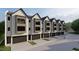 Modern townhome community with attached garages and sleek exterior design at 810 Maple Berry Ln # 106, Raleigh, NC 27607