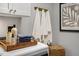 Laundry room with white cabinets, washer, dryer, and stylish decor at 156 Pinkie Ln, Garner, NC 27529