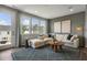 Relaxing living room with sectional sofa and large windows at 156 Pinkie Ln, Garner, NC 27529