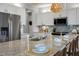 Modern kitchen with white cabinets, granite countertops, and a large island at 156 Pinkie Ln, Garner, NC 27529