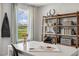 Bright home office features built-in shelving and a view of the community at 156 Pinkie Ln, Garner, NC 27529