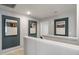 Upstairs hallway with framed artwork and neutral wall colors at 156 Pinkie Ln, Garner, NC 27529