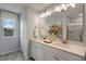 Double vanity bathroom with a large mirror and walk in shower at 156 Pinkie Ln, Garner, NC 27529