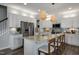 Spacious kitchen with an island, white cabinets, and granite countertops at 156 Pinkie Ln, Garner, NC 27529