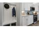 Modern kitchen with white cabinets and granite countertops at 156 Pinkie Ln, Garner, NC 27529