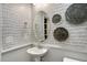 Powder room with decorative wall paper and pedestal sink at 156 Pinkie Ln, Garner, NC 27529