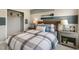 Bedroom with a plaid comforter, two nightstands, and a built-in closet at 156 Pinkie Ln, Garner, NC 27529