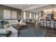 Open concept living room with sectional sofa and view of kitchen at 156 Pinkie Ln, Garner, NC 27529