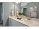 Double vanity bathroom with a large mirror and light gray walls at 156 Pinkie Ln, Garner, NC 27529