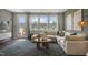 Bright Gathering room featuring a sectional sofa, large windows, and access to a patio at 156 Pinkie Ln, Garner, NC 27529