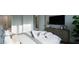 Spacious bedroom with dresser, large bed, and ensuite bathroom access at 13625 Old Creedmoor Rd, Wake Forest, NC 27587