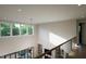 Bright upper hallway with a view of the living room below at 13625 Old Creedmoor Rd, Wake Forest, NC 27587