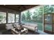Relaxing screened porch with comfy seating and a ceiling fan at 13625 Old Creedmoor Rd, Wake Forest, NC 27587