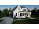 Two story modern farmhouse with white brick and gray siding at 13625 Old Creedmoor Rd, Wake Forest, NC 27587