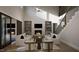 Spacious living room with a fireplace, built-in shelving, and large windows at 13625 Old Creedmoor Rd, Wake Forest, NC 27587