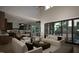 Open living room showcasing ample seating, high ceilings, and kitchen views at 13625 Old Creedmoor Rd, Wake Forest, NC 27587