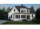 Two story modern farmhouse with white brick and gray siding at 13625 Old Creedmoor Rd, Wake Forest, NC 27587