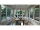 Bright dining room features a large table, several chairs, and abundant natural light at 13625 Old Creedmoor Rd, Wake Forest, NC 27587