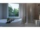 Spa-like bathroom with soaking tub, walk-in shower, and natural light at 13625 Old Creedmoor Rd, Wake Forest, NC 27587