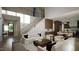 Open concept living room with staircase, kitchen, and access to backyard at 13625 Old Creedmoor Rd, Wake Forest, NC 27587