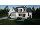 Two story modern farmhouse with white brick and gray siding at 13625 Old Creedmoor Rd, Wake Forest, NC 27587
