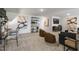 Open loft with seating area and built-in shelving at 2321 Sugar Cone Way, Fuquay Varina, NC 27526