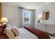 Bedroom with maroon bedding and white dresser at 2321 Sugar Cone Way, Fuquay Varina, NC 27526