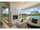 Relaxing patio with fireplace and seating at 8916 Grand Highland Way, Wake Forest, NC 27587