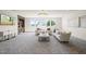 Bright recreation room with large windows and comfortable seating at 8916 Grand Highland Way, Wake Forest, NC 27587