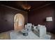 Dark-walled sitting room with two armchairs and a coffee table at 8916 Grand Highland Way, Wake Forest, NC 27587