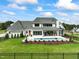 Luxury home with pool and fenced backyard, offering privacy and outdoor enjoyment at 8916 Grand Highland Way, Wake Forest, NC 27587