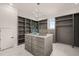 Spacious walk-in closet with ample shelving and drawers at 8916 Grand Highland Way, Wake Forest, NC 27587