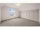 Bright bedroom with carpeted floors and window views at 8916 Grand Highland Way, Wake Forest, NC 27587