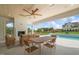 Outdoor kitchen, pool, and seating area at 8916 Grand Highland Way, Wake Forest, NC 27587