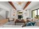Spacious living room featuring hardwood floors, fireplace, and large windows at 8916 Grand Highland Way, Wake Forest, NC 27587