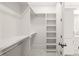 Bright walk-in closet with shelving and hanging rods at 8916 Grand Highland Way, Wake Forest, NC 27587