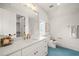 Modern bathroom with white vanity, blue tile floor, and gold fixtures at 8916 Grand Highland Way, Wake Forest, NC 27587