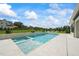 Inviting pool with spa and fire features, expansive patio, and lush landscaping at 8916 Grand Highland Way, Wake Forest, NC 27587