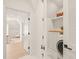 Convenient laundry room with washer, dryer, and built-in shelving at 8916 Grand Highland Way, Wake Forest, NC 27587