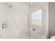 Spa-like shower with marble tile and glass enclosure at 8916 Grand Highland Way, Wake Forest, NC 27587