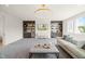 Spacious recreation room, built-in shelving, and comfortable seating at 8916 Grand Highland Way, Wake Forest, NC 27587